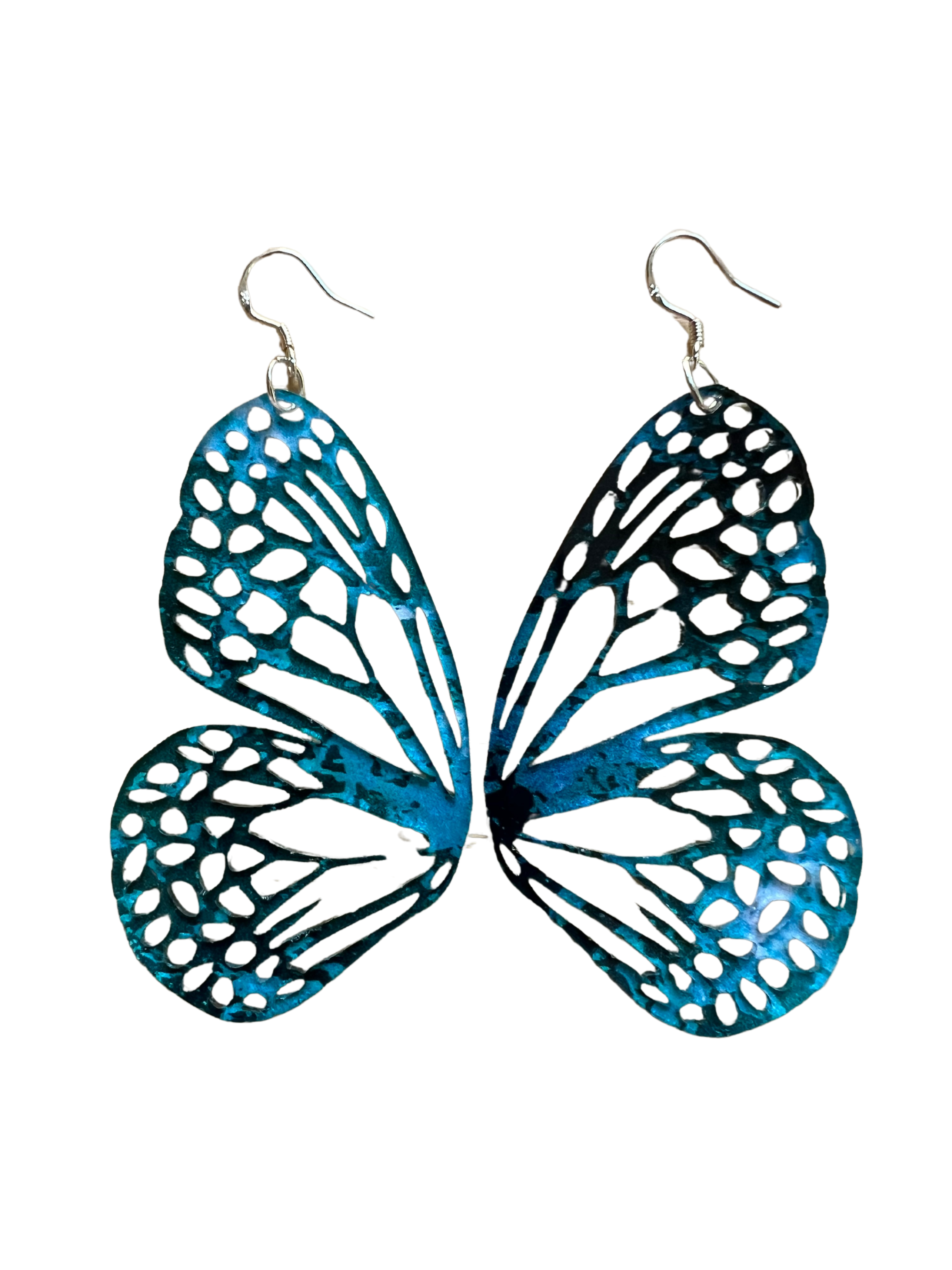 Butterfly wing earrings with blue and white design on a white background