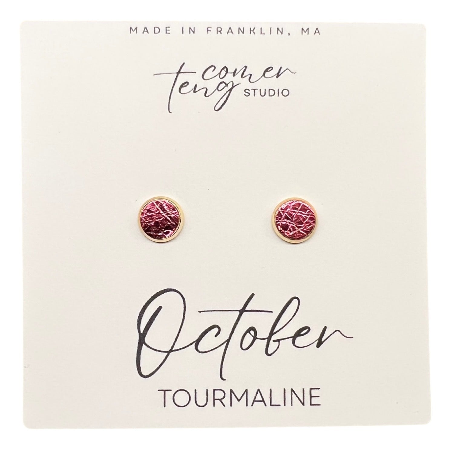 Pair of earrings on a card with 'October Tourmaline' text and branding.