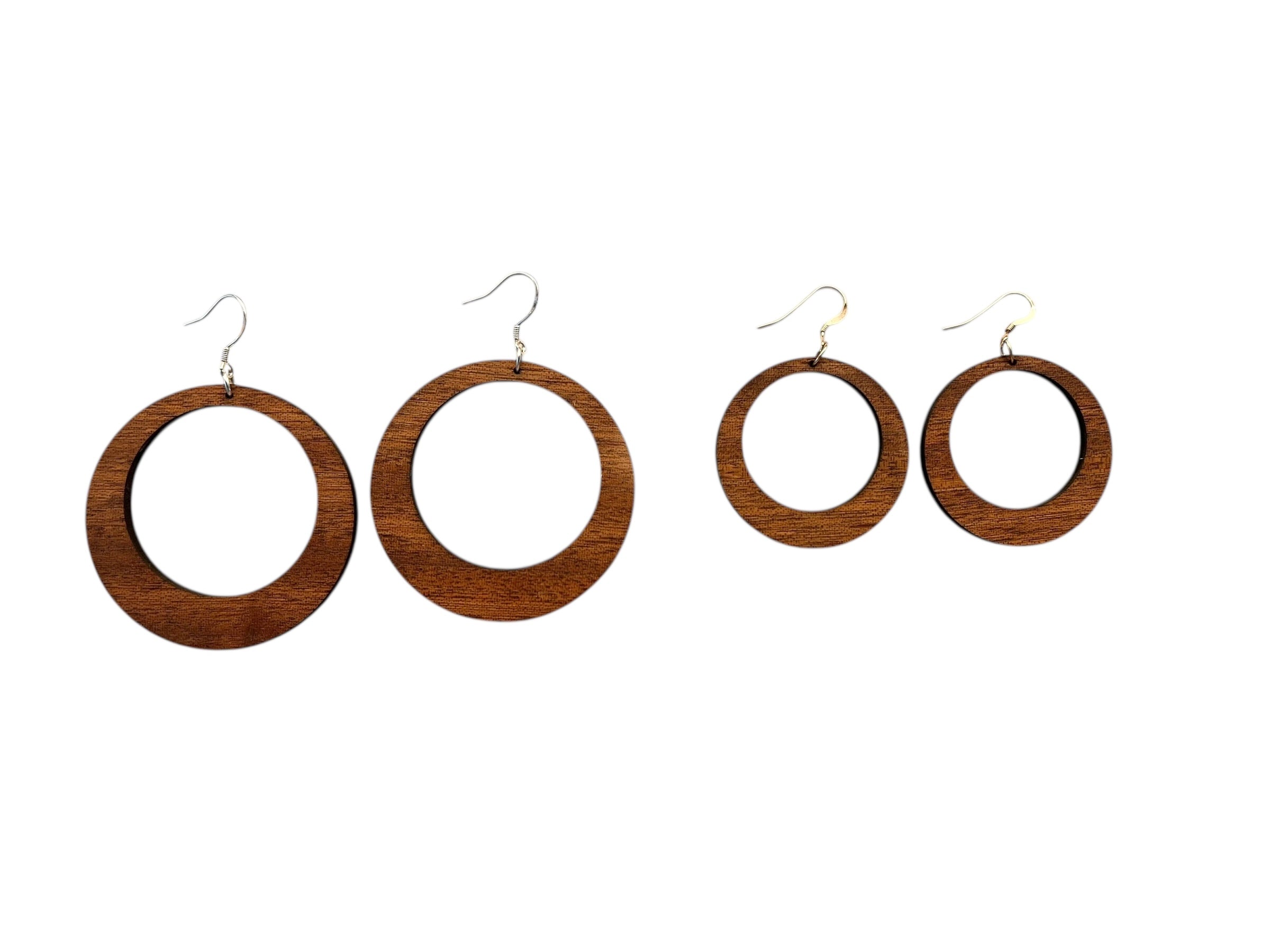 Set of wooden hoop earrings on a white background