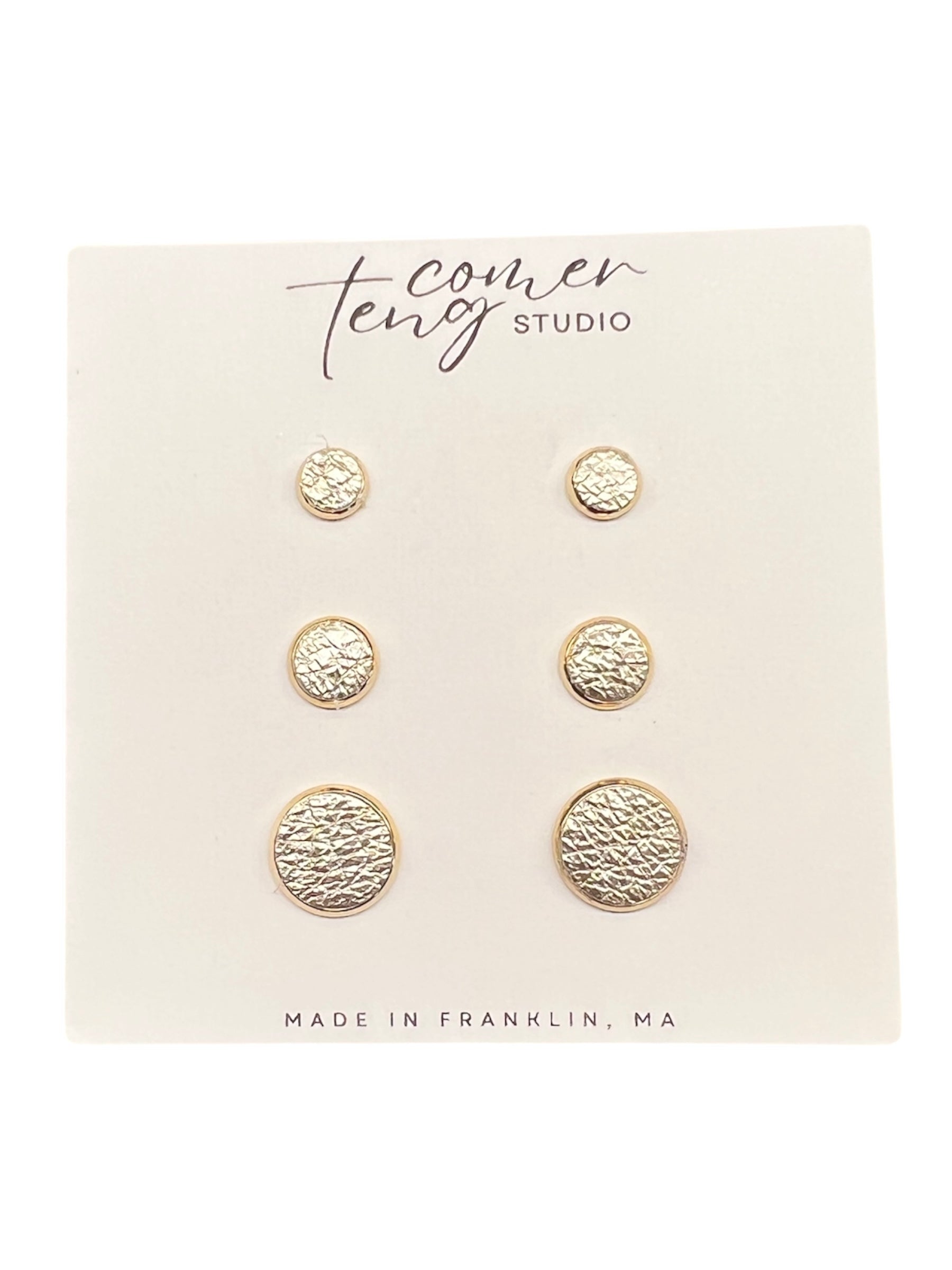 Set of silver stud earrings on a card
