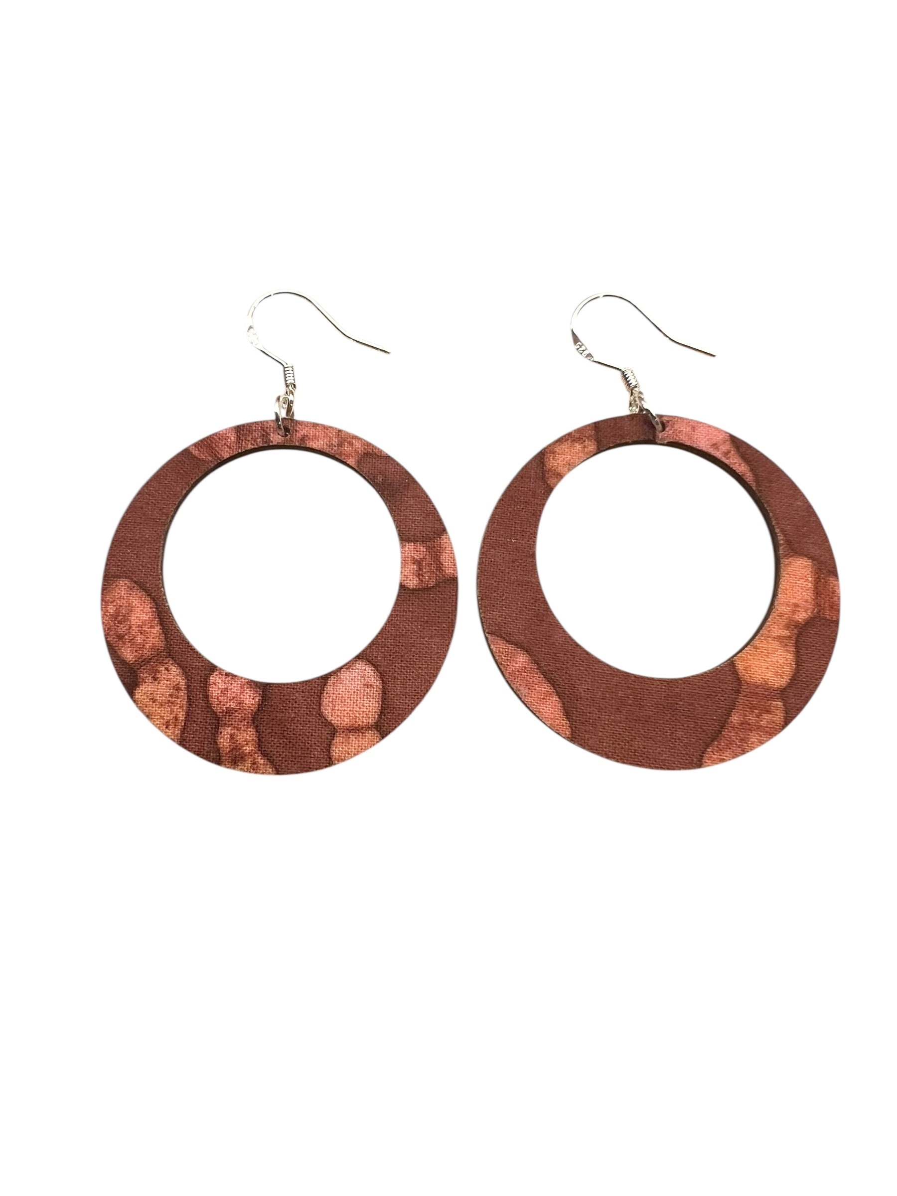 Wooden hoop earrings with a natural finish on a white background