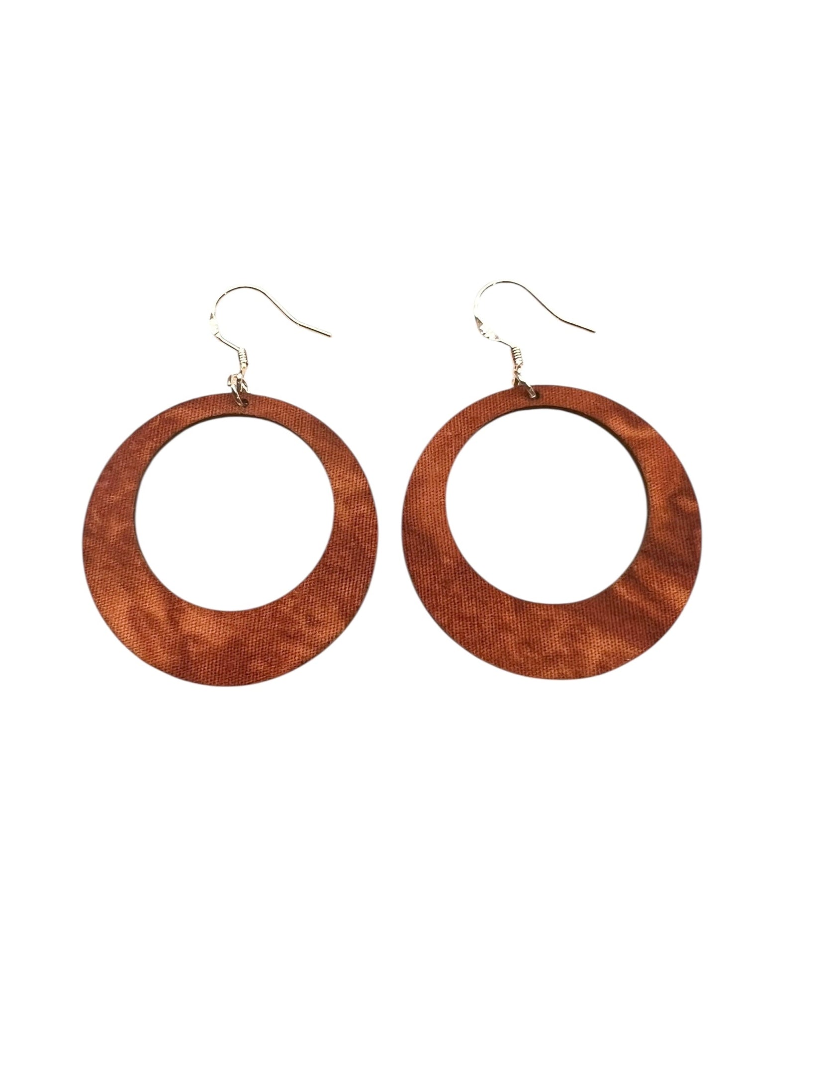 Wooden hoop earrings on a white background