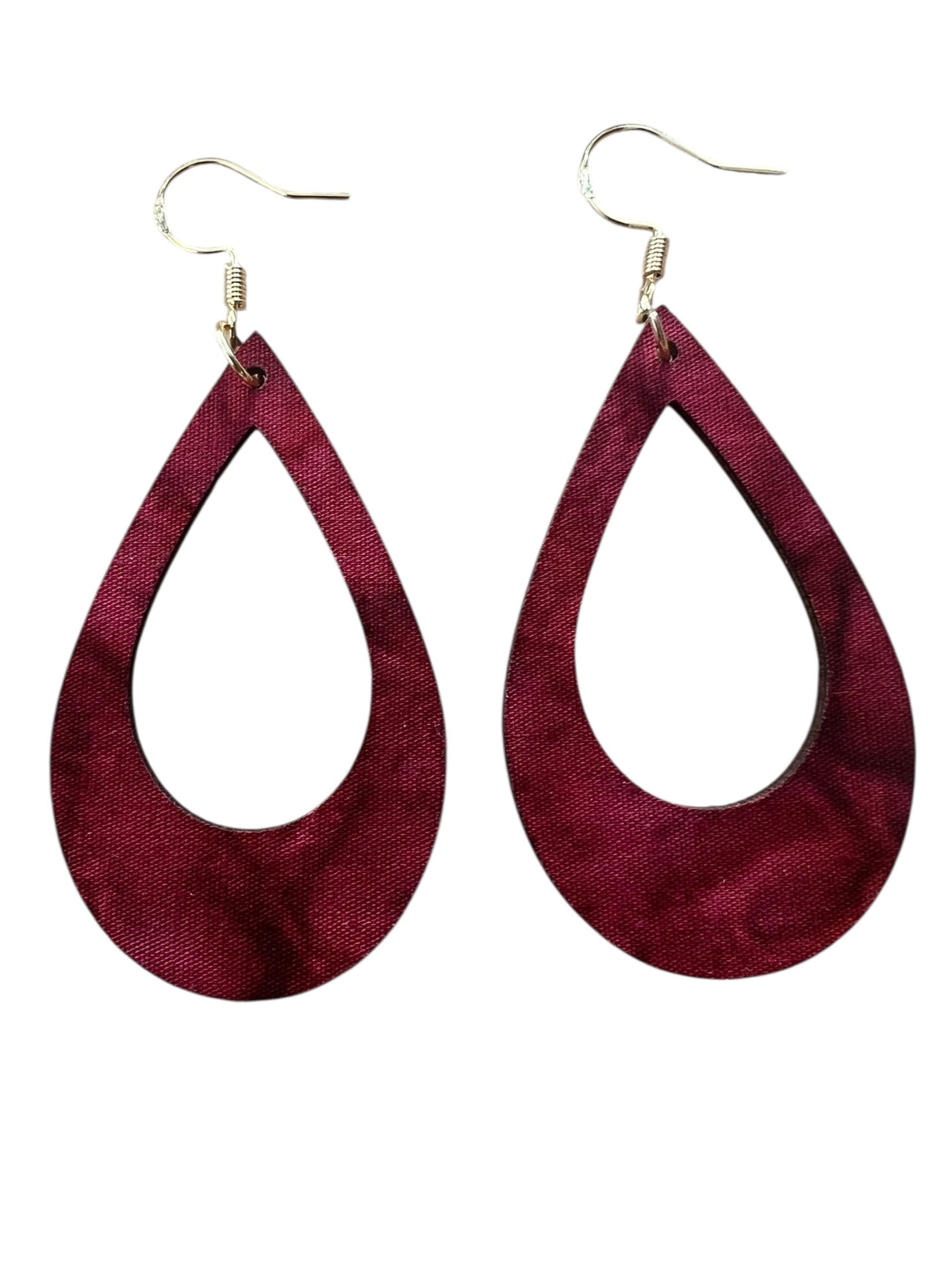 Pair of maroon teardrop earrings on a white background