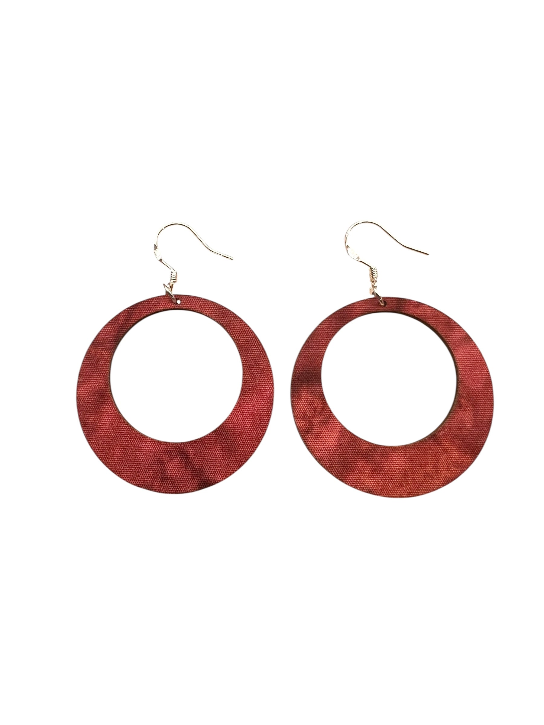 Wooden hoop earrings on a white background