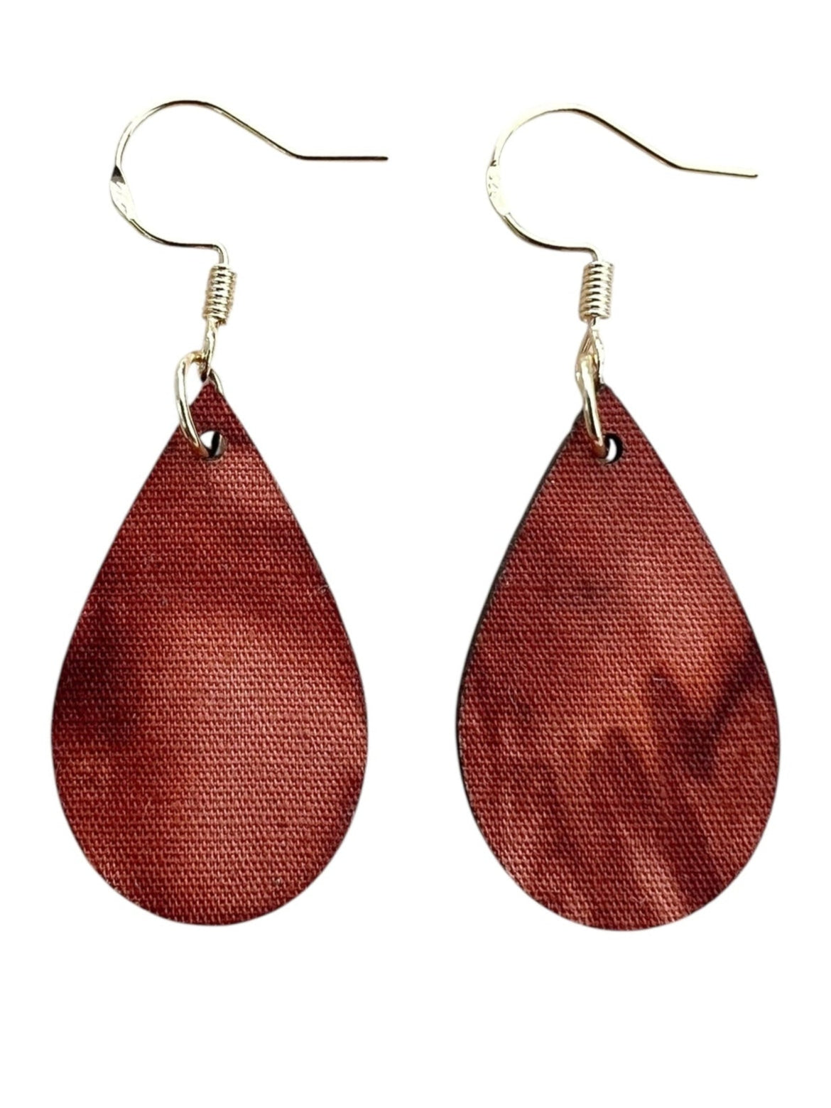 Teardrop-shaped brown earrings on a white background