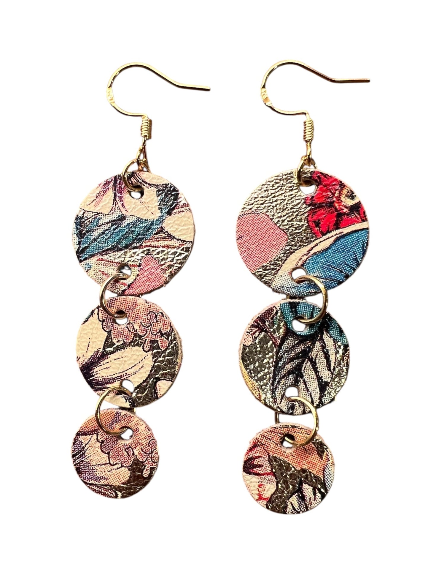 Colorful layered disc earrings on a white background