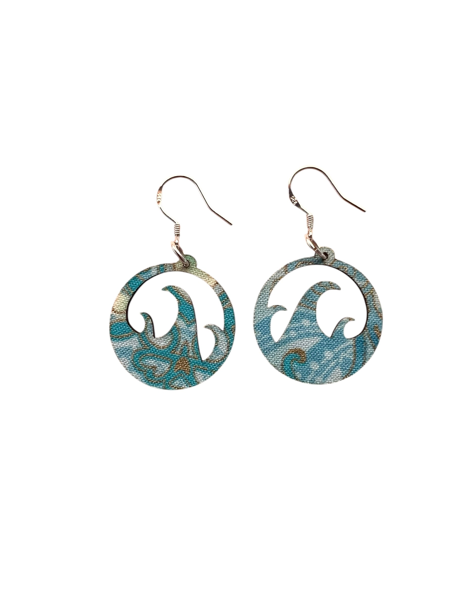 Pair of earrings with a blue and green pattern on a white background