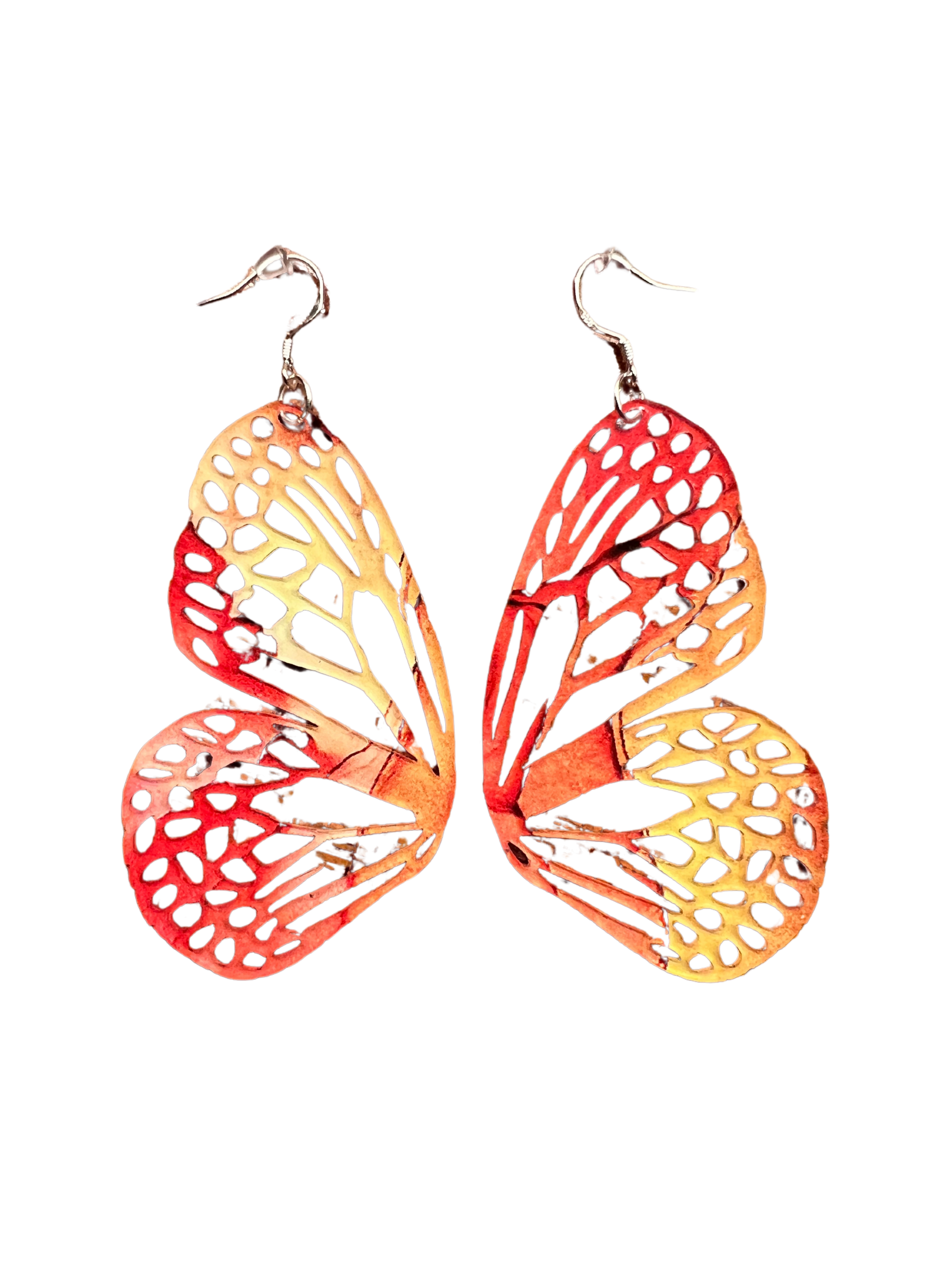Pair of orange and red earrings on a white background