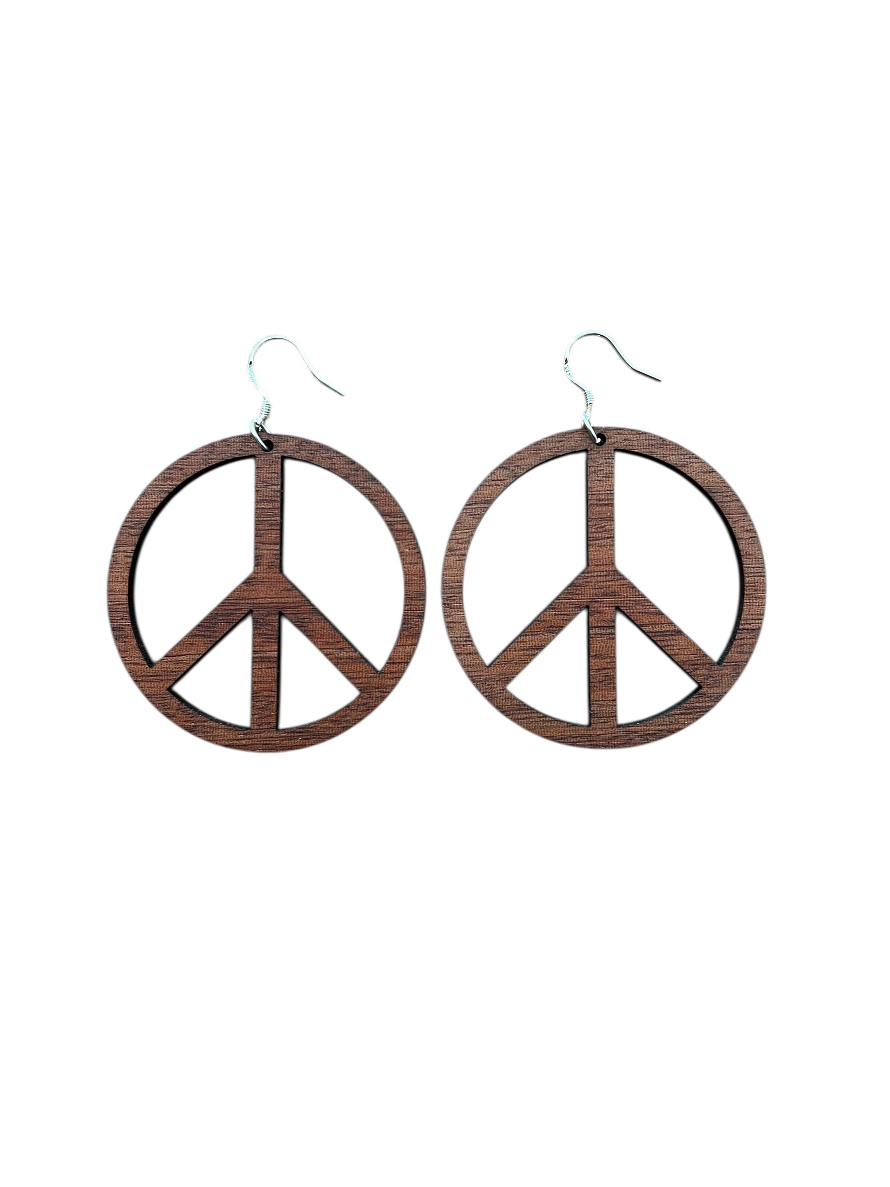 Peace symbol earrings on a white background