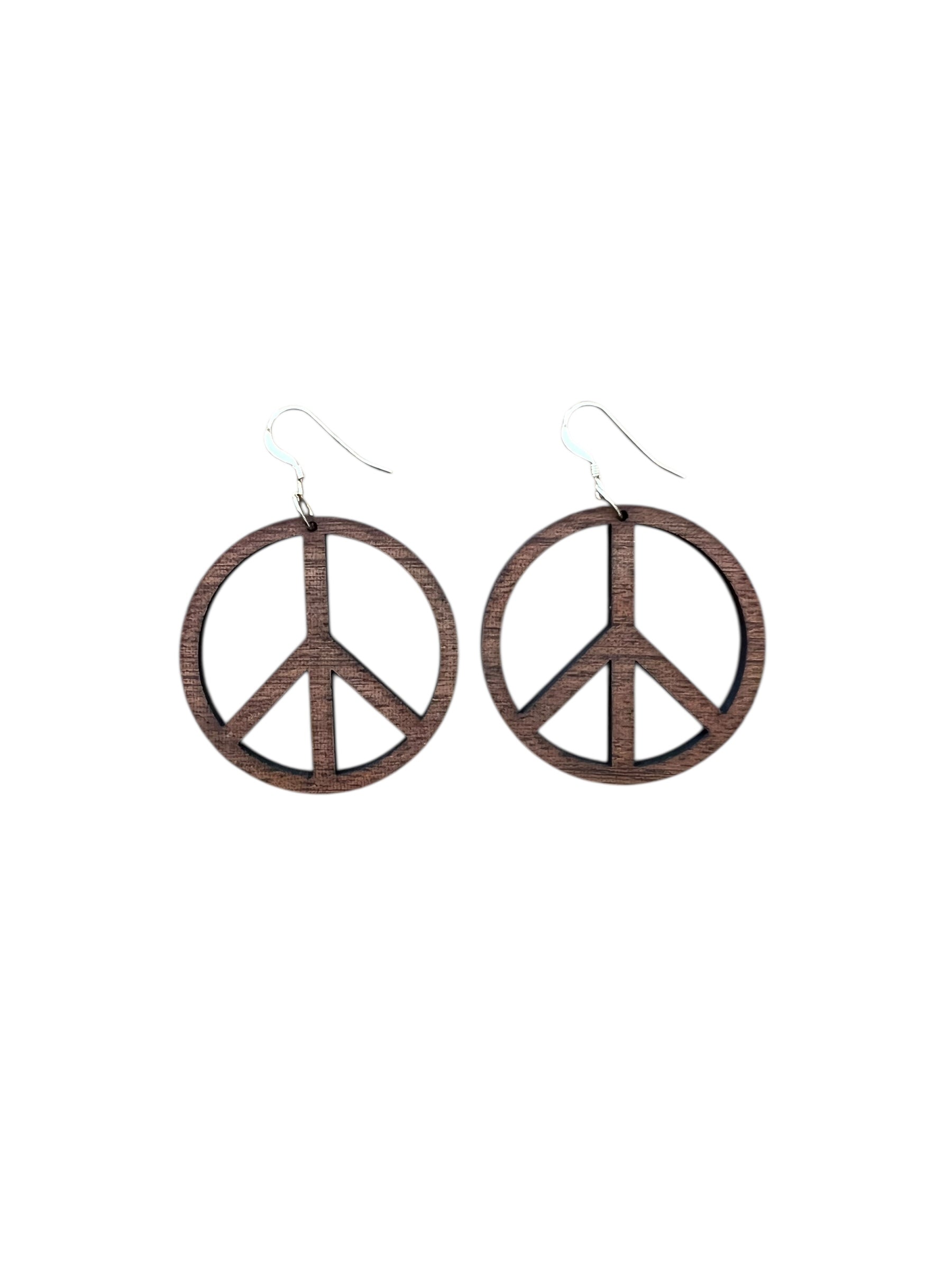 Peace symbol earrings on a white background