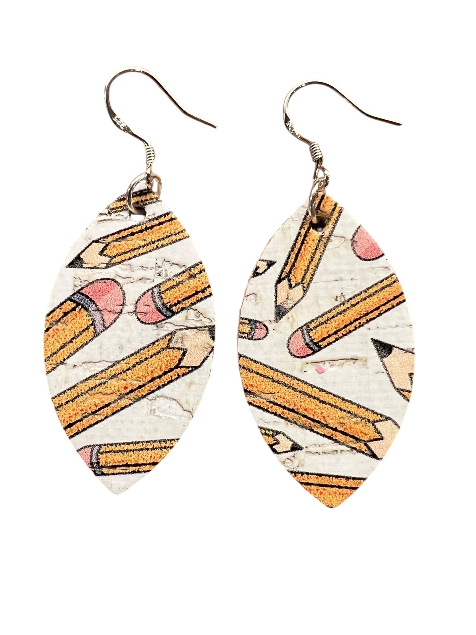 Pair of earrings with pencil design on a white background