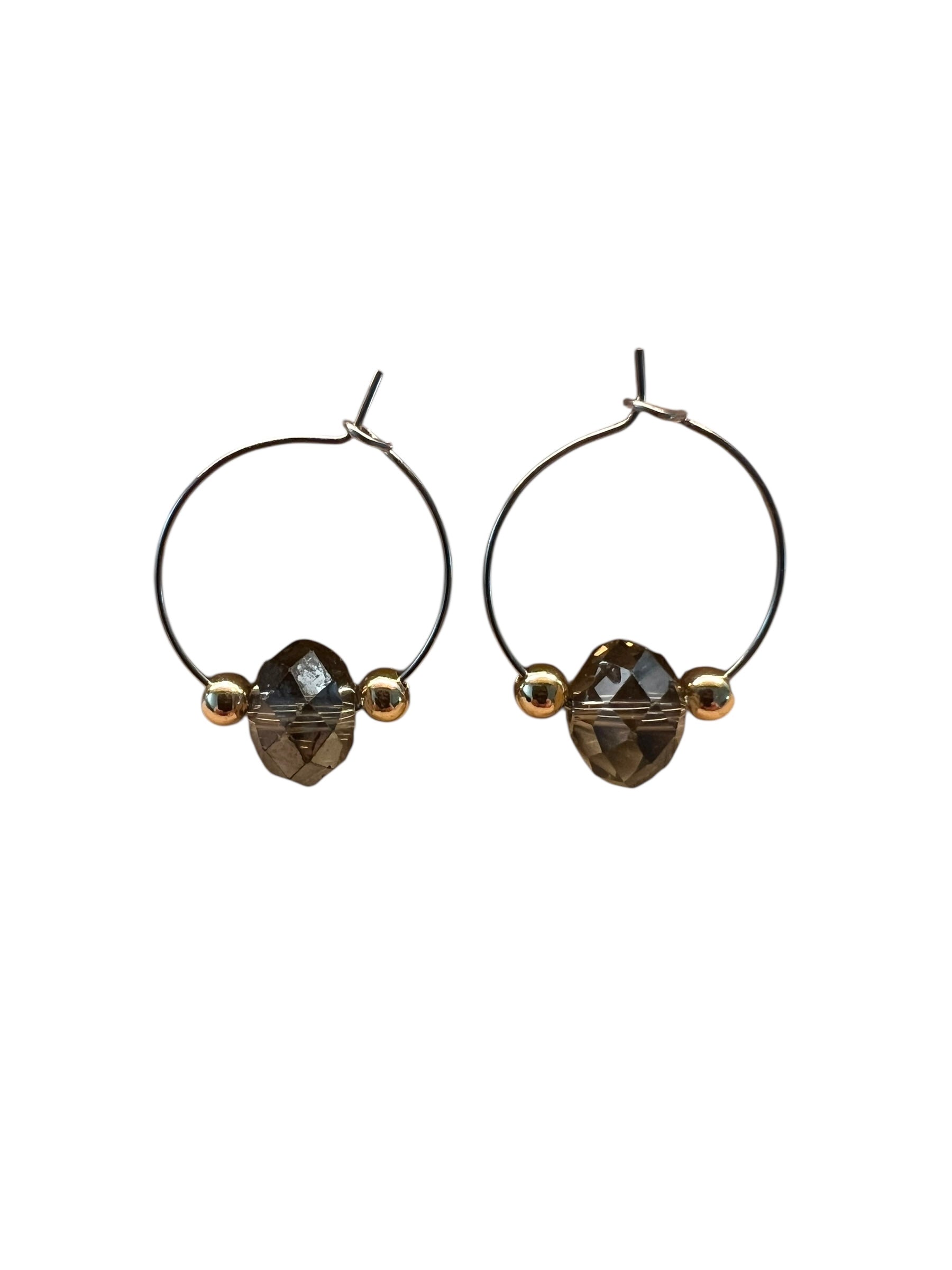 Pair of hoop earrings with smoky quartz stones on a white background