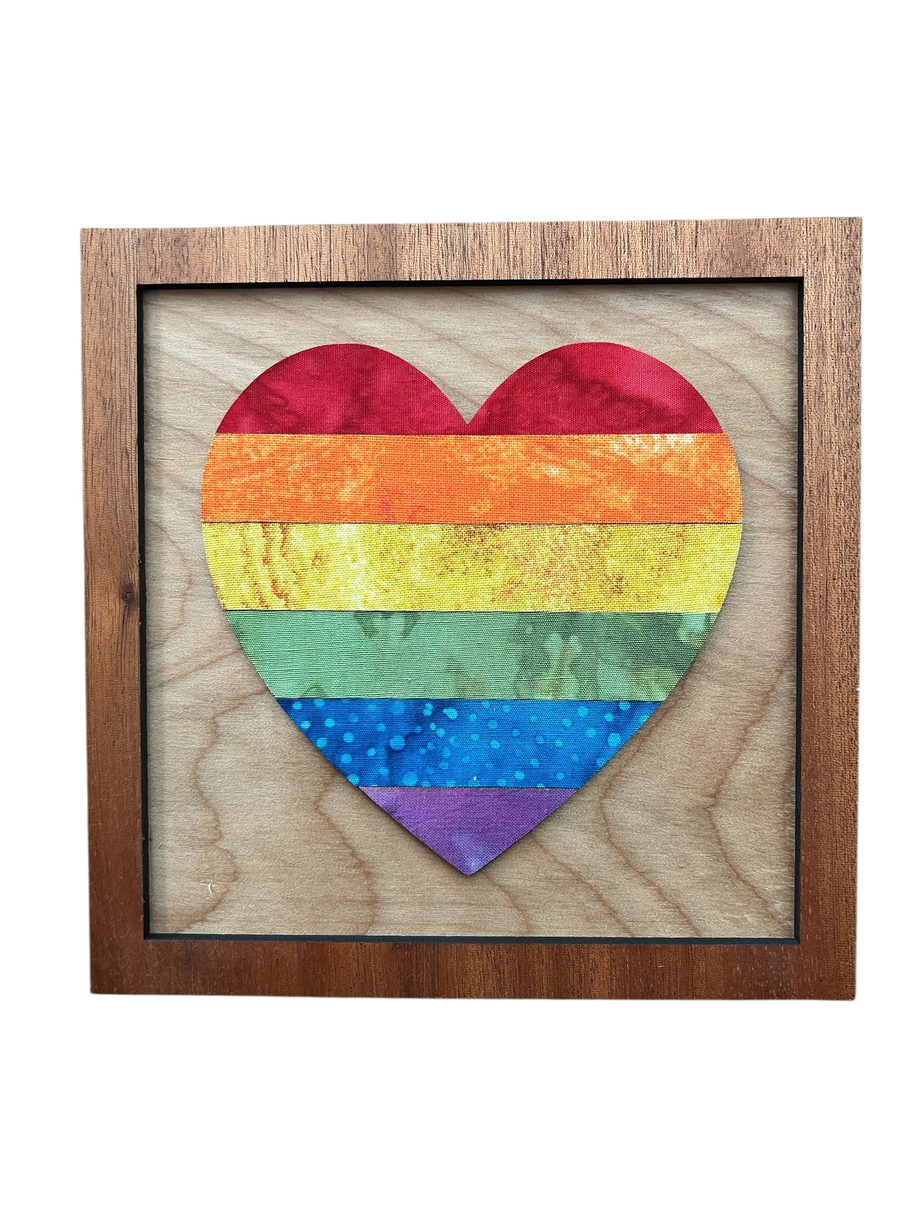 Wooden frame with a rainbow heart design on a white background