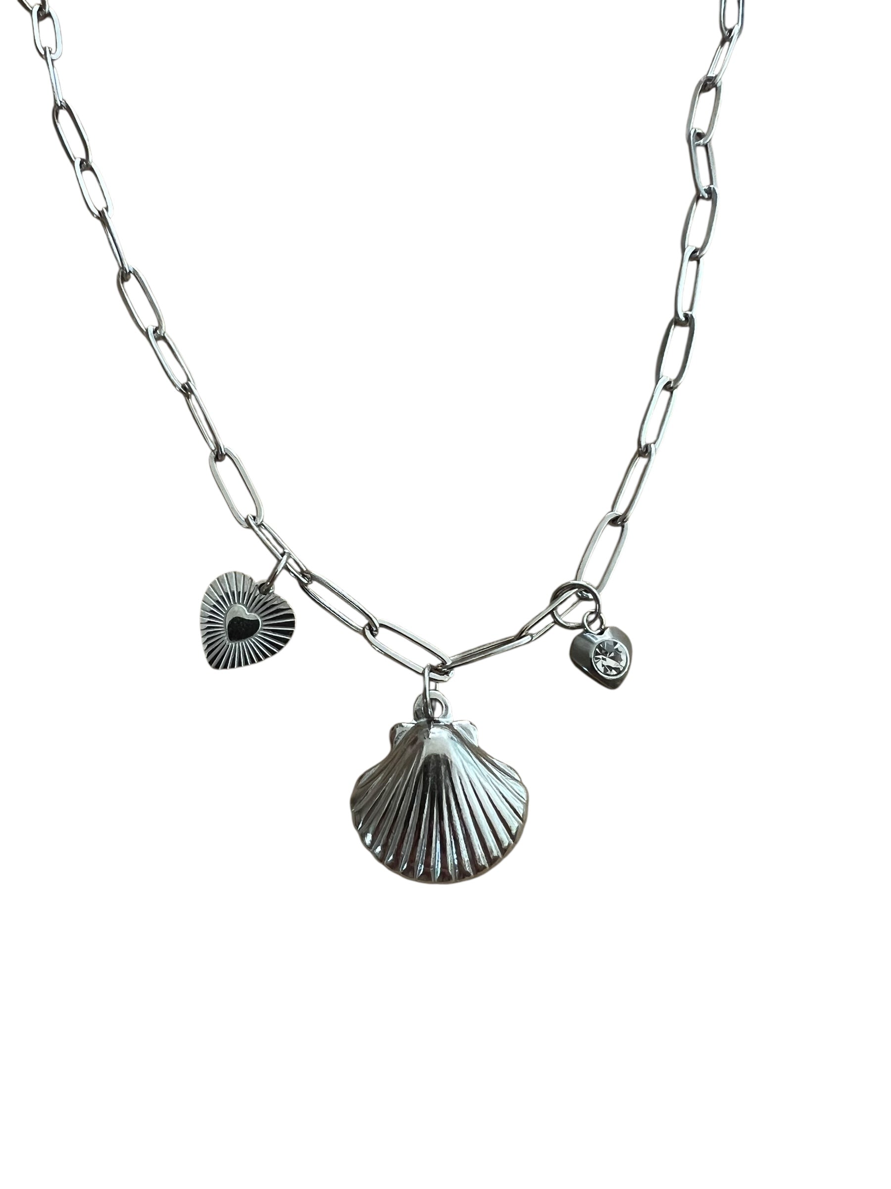 Necklace with shell and heart charms on a white background