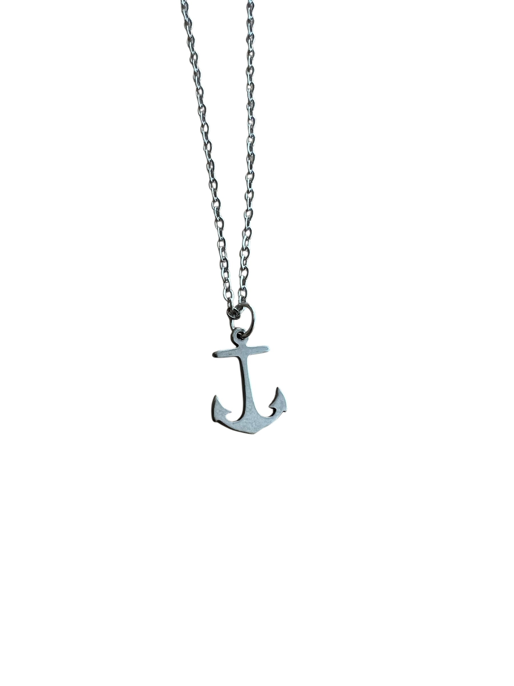 Silver anchor necklace on a white background