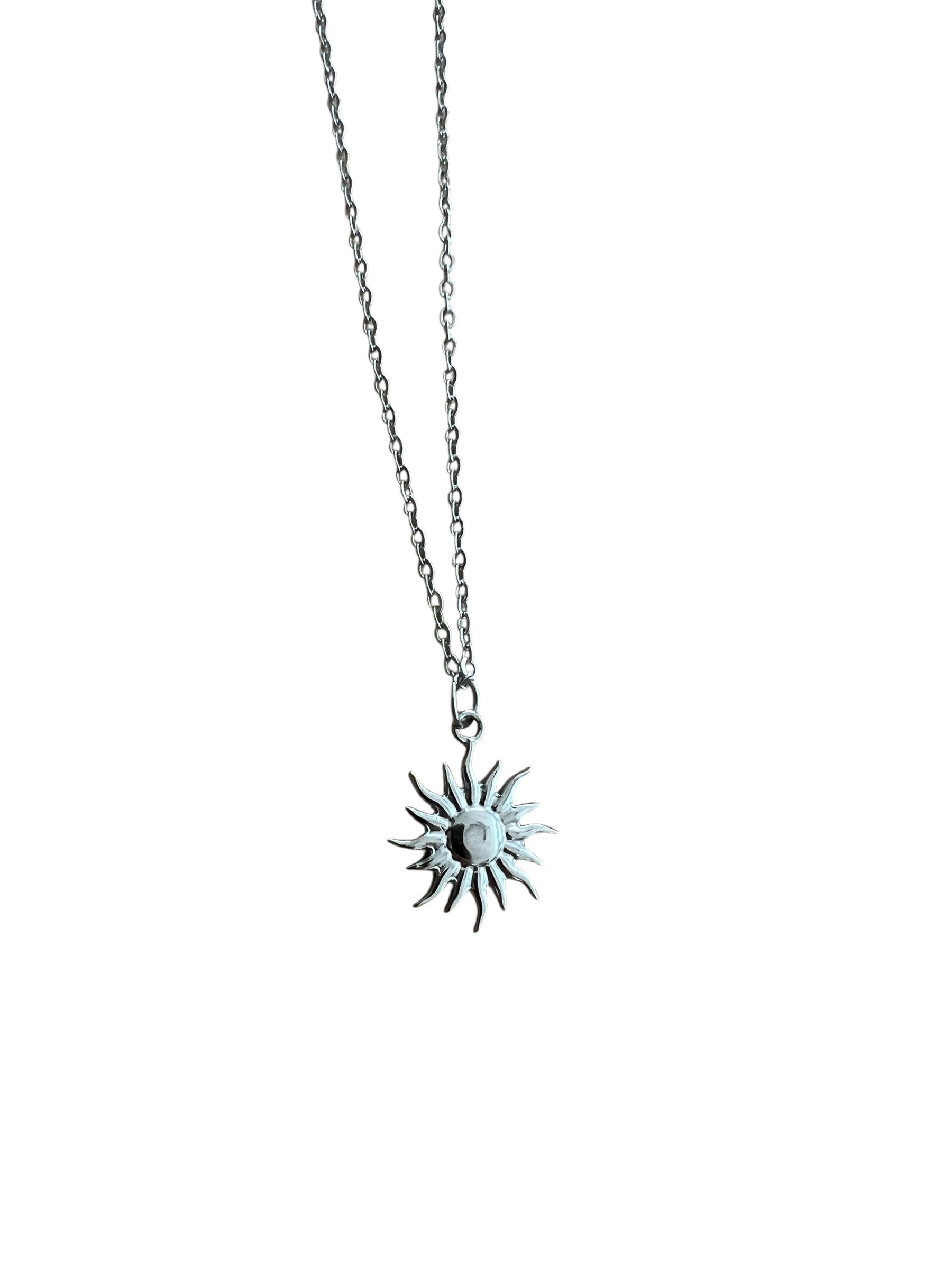 Necklace with a sun-shaped pendant on a white background