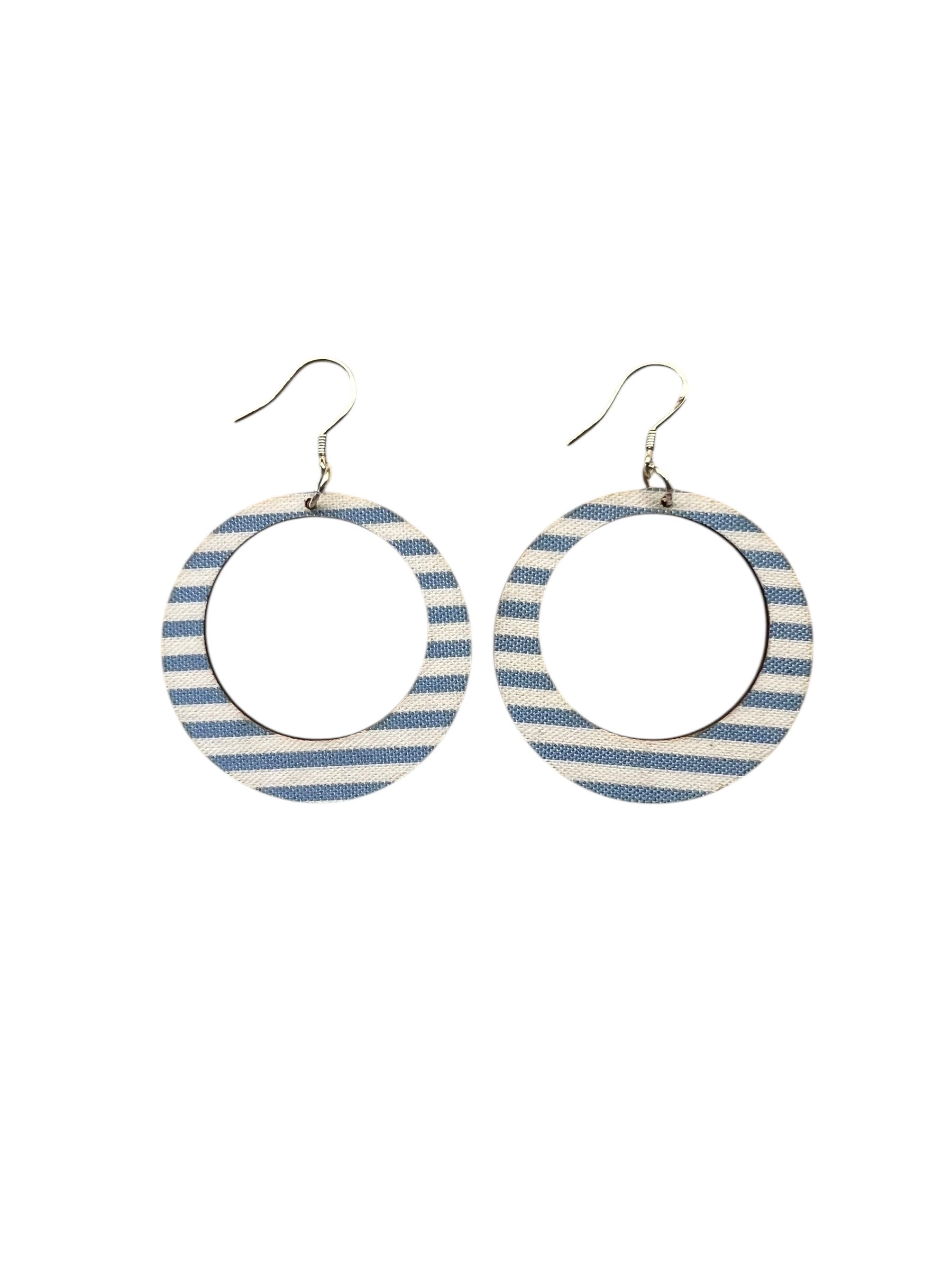 Pair of hoop earrings with blue and white striped design on a white background