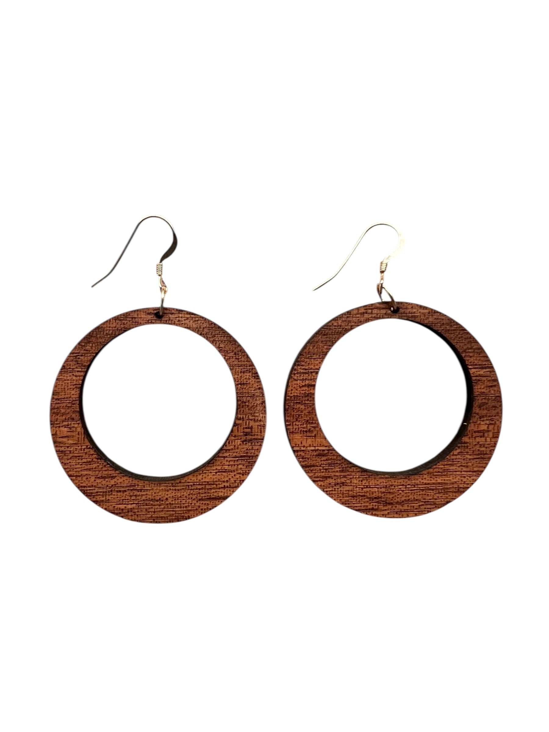 Wooden hoop earrings on a white background